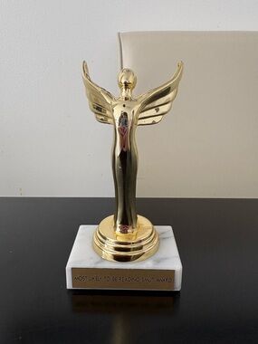 Gold Angel Trophy Sculpture most likely to be reading smut